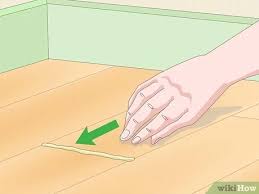 Patch gaps in laminate floors laminate flooring laminate. 3 Ways To Close Gaps In Laminate Flooring Wikihow