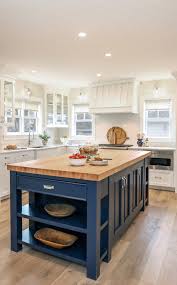 The one with the chairs is cheaper than the one without the chairs. Kitchen With Blue Island Home Bunch Interior Design Ideas