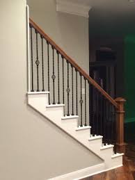 Had a small job to turn 10 balcony balusters for a remodel brownstone in dc. Replaced White Wood Balusters With Iron And Stained Poplar Wood Chestnut Brown Wood Balusters Modern Stair Railing Modern Stairs