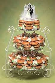 Not Quite Classy But Darned Tasty Manolo For The Brides Donut Wedding Cake Doughnut Wedding Cake Wedding Donuts