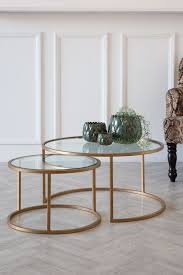 Its solid wood tops feature different tonal finishes, which add character not just to the tables. Set Of 2 Circular Glass Brass Coffee Tables Rockett St George