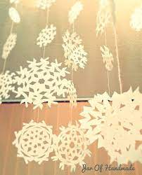 Jar Of Handmade Diy Paper Snowflakes Hanging From The Ceiling Paper Snowflakes Diy Winter Classroom Decorations Xmas Decorations Diy