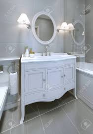 We have the area's largest showroom of bamboo, rattan, regency furniture, desks, tables, lamps, chandeliers, mirrors, cabinets, artwork and more since 2004. White Art Deco Styled Sink Console In Bathroom Round Mirror Stock Photo Picture And Royalty Free Image Image 50514234