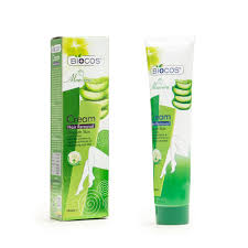 Tube of hair removal cream with green accents