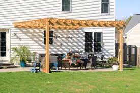The pergola will be attached to the house with a ledger board. Amish Built Pergola Attached To A House Wooden Attached Pergola