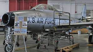 republic f 84e f 84g 16 re sn 51 10454 four queens in the restoration hangar at the national museum of the usaf nmusaf usaf national museum military helicopter