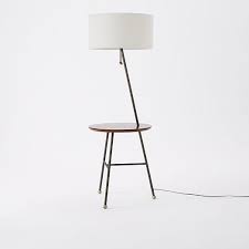 This floor lamp with attached side table is outfitted with double usb ports and an outlet so that you can charge your mobile devices or plug in your computer. Duo Side Table Floor Lamp