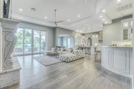 Consider the kitchen's size, as. Contemporary Living Room With Stone Fireplace Hardwood Floors West Elm Slab Box Frame Coffee Table Fre Wood Floor Kitchen Living Room Flooring Grey Flooring