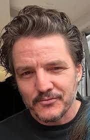 Pedro Pascal rocks a retro beige blazer and rust shirt, marking a stylish  shift from his earlier casual dark sweaters and clean-shaven face.