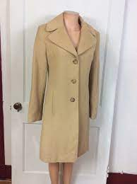 Soft camel hair blend fabric construction with a hidden zip front closure and front toggles. Pin On Throwback Style