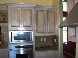 The doors and drawer faces were replaced and the cabinets were painted and glazed. Crackle Finish On Kitchen Cabinets Painting Kitchen Cabinets Painting Kitchen Cabinets White White Kitchen Appliances