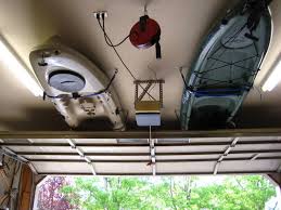 This ceiling storage lift by racor is perfect for storing bulky items that would normally take up floor space like outdoor furniture, boxes and totes. Kayak Garage Storage How To Kayak Storage Garage Kayaking Garage Storage Organization
