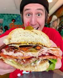 a sub big enough for Scooby Doo . 🥪 Michael's Super Sub: smoked turkey,  capicola, bacon, pepperjack cheese, lettuce, tomato, onion, giardiniera,  mustard, mayo, italian dressing . 📍 @michaelsgoodyboy . . . . . #