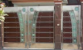 The dark grey timbers are placed inside the black steel frame and pairs with the white posts. Stainless Steel Main Gate Designs Decorchamp