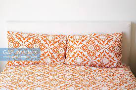 Decorate your laptops, water bottles, notebooks and windows. Bed With Orange Prin Stock Photo By Built Image 0032028
