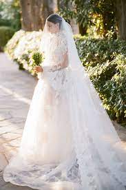 Appliqued white tulle overlay one shoulder bridal gown. 6 Of The Most Romantic Dresses And How To Choose Yours Les Anagnou Photographers