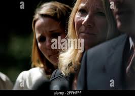 dyer 016 ls.JPG From left: Allyn Dyer (sister of Ashlyn), Marsha Dyer  (mother of Ashlyn) and Bruce Dyer (father of Ashlyn). Allyn Dyer and Marsha  Dyer listen as Bruce Dyer reads a perpared statement at the site of where  she was killed a year ago in a hit and ...
