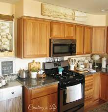 The exposed mechanical ductwork and pipeline look awful! Decorating Ideas For Kitchen Soffit Kitchen Decor Sets