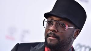 Qantas says it will help flight attendant sue will.i.am over 'racist' row