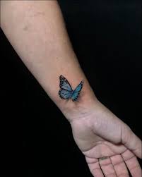 A large dark blue butterfly tattoo on the back. 50 Really Beautiful Butterfly Tattoos Designs And Ideas With Meaning