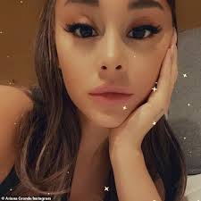 Ariana Grande passionately kisses her real estate beau Dalton Gomez