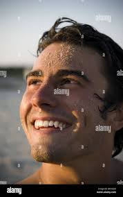 Man smiling with sand