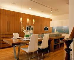 Contrasting wood panel for eating is an awesome addition to a modern kitchen island. 15 Beautiful Kitchen Island With Table Attached Home Design Lover