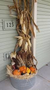 Flanking your door with towering cornstalks is a bold seasonal statement. Rustic Chic 27 Corn Husks Decor Ideas For Fall Shelterness