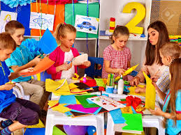 This is a practice writing and fun art activity. Children And Colored Paper Making Something On Table In Primary Stock Photo Picture And Royalty Free Image Image 93868412