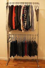Made with 1/2 galvanized pipe and 1x8 wood. Diy Pipe Clothing Rack