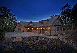 Timber Accents On Exterior Stone Facade Arched Clerestory Windows The Southern Comfort By Custom Timber Log Homes Timber Logs Log Homes House Exterior