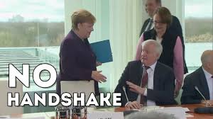 The best gifs for corona. German Minister Refuses To Shake Merkel S Hand Over Coronavirus Fear Youtube