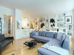 'this modern apartment features dark grey crittall windows, which pick up on the colors of the city views outside, so we wanted the window seat and cushions to add another layer to this calm and cohesive reading corner,' says. Spacious Black White And Grey Apartment