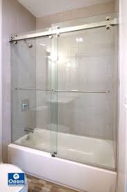 The Oasis Accella Sliding Shower Door Features 3 8 Thick Safety Glass Panels Hung From An Ind Sliding Shower Door Shower Doors Frameless Sliding Shower Doors
