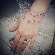 Bike chain link tattoo chain tattoos on pinterest chains bike chain. Bracelet Tattoo Ideas Popsugar Beauty