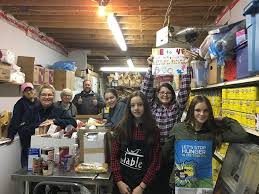 Riverside's Me to We team scares off hunger with monster haul at  Halloween-themed food drive