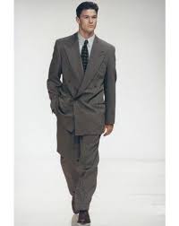 So a suit is a combination of a jacket and a pair of pants in a matching fabric. Style Evolution The Armani Suit Armani Suits Mens Suits 80s Fashion Men