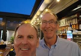 Rhode Barton and Polly Black with a family photo