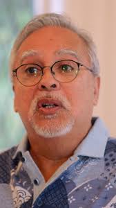 How can we erase the wounds of racism, sexism, capitalism, and society's  damaging built-in -isms? Elliot Watts wrestles with these threats because  he believes everyone deserves to live with dignity. This quest