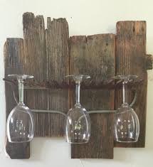 If your kitchen is small and you have to make due with open storage, this glasses holder can serve as a means to keep the cluttered look. Barn Wood Rake Wine Glass Rack Rustic Wine Racks Wine Glass Rack Wine Glass Holder