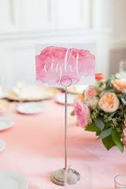 These beautiful botanical themed table numbers mix watercolor botanical patterns with gold geometric shapes. 51 Unique Table Number Ideas For Wedding Receptions And Diys