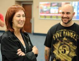 Joyce Marcus, a Florida resident, gets emotional after