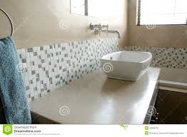 modern bathroom sink with white mosaics