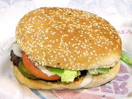 So for a whopper jr use a 4 inch (10.2 cm) sesame bun (instead of a 5inch), a 4 inch (10.2 cm) patty (instead of a 5inch), 2 pickles (instead of 4), 1 tomato (instead of 2), and less than a handful of onions (instead of a handful). Whopper Definition Und Synonyme Von Whopper Im Worterbuch Englisch