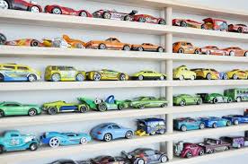 If your house is like ours, you probably have a healthy collection of hot wheels or matchbox cars lying around! Diy Matchbox Car Garage Updated A Lo And Behold Life Matchbox Car Storage Matchbox Car Diy Matchbox