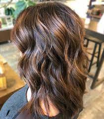 Add more volume to your hair by styling some loose waves with a curling iron. 39 Sweetest Caramel Highlights On Light Dark Brown Hair