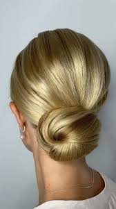If you want the hairdo to look classy, before styling the bun, straighten your hair. 75 Trendiest Updo Hairstyles 2021 Sophisticated Textured Low Bun For Long Hair