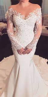 The dress is featuring off the shoulder, long sleeve, drawstring waist, embroidered pattern and mini length.;material: 36 Off The Shoulder Wedding Dresses To See Long Sleeve Wedding Dress Lace Mermaid Long Sleeve Mermaid Wedding Dress Tight Wedding Dress