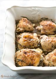 Herb Roasted Chicken Thighs With Potatoes Recipe Simplyrecipes Com Recipe Recipes Herb Roasted Chicken Roasted Chicken Thighs