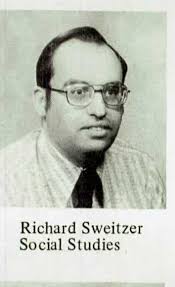 Name of economics teacher obsessed with a person?